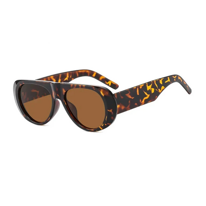 Nyara shield women's sunglasses in tortoise acetate frame with amber TAC lenses, 100% UV protection, right 3/4 angle view on white background