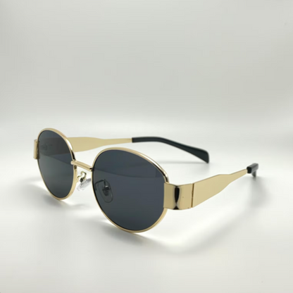 Side view of Aurora women’s retro oval sunglasses in Gold frame with Black lenses, on white background — stainless steel frame, polycarbonate lenses, UV400 protection