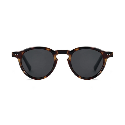 Front view of Solis women’s round sunglasses in Tortoise frame with Black lenses, on white background — acetate frame, TAC lenses, 100% UV protection