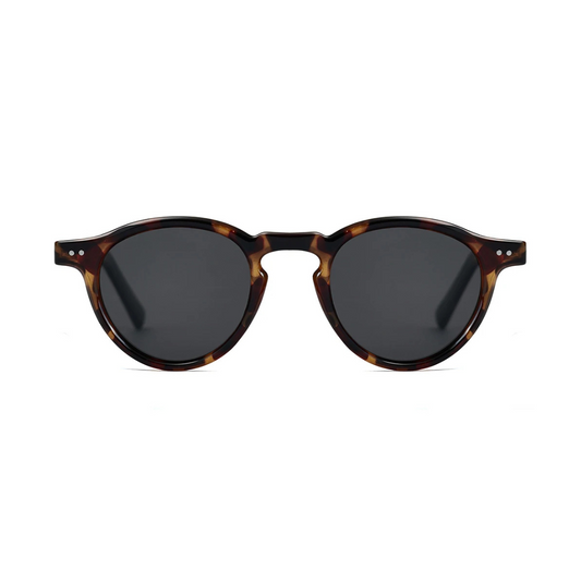 Front view of Solis women’s round sunglasses in Tortoise frame with Black lenses, on white background — acetate frame, TAC lenses, 100% UV protection