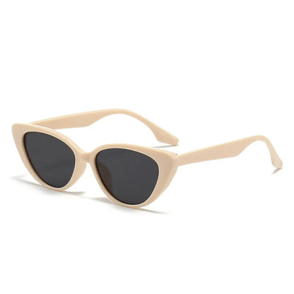 Right 3/4 angle of Noire women’s cat-eye shades in Beige frame with Black lenses, on white background — polycarbonate frame, acrylic lenses, 100% UV protection