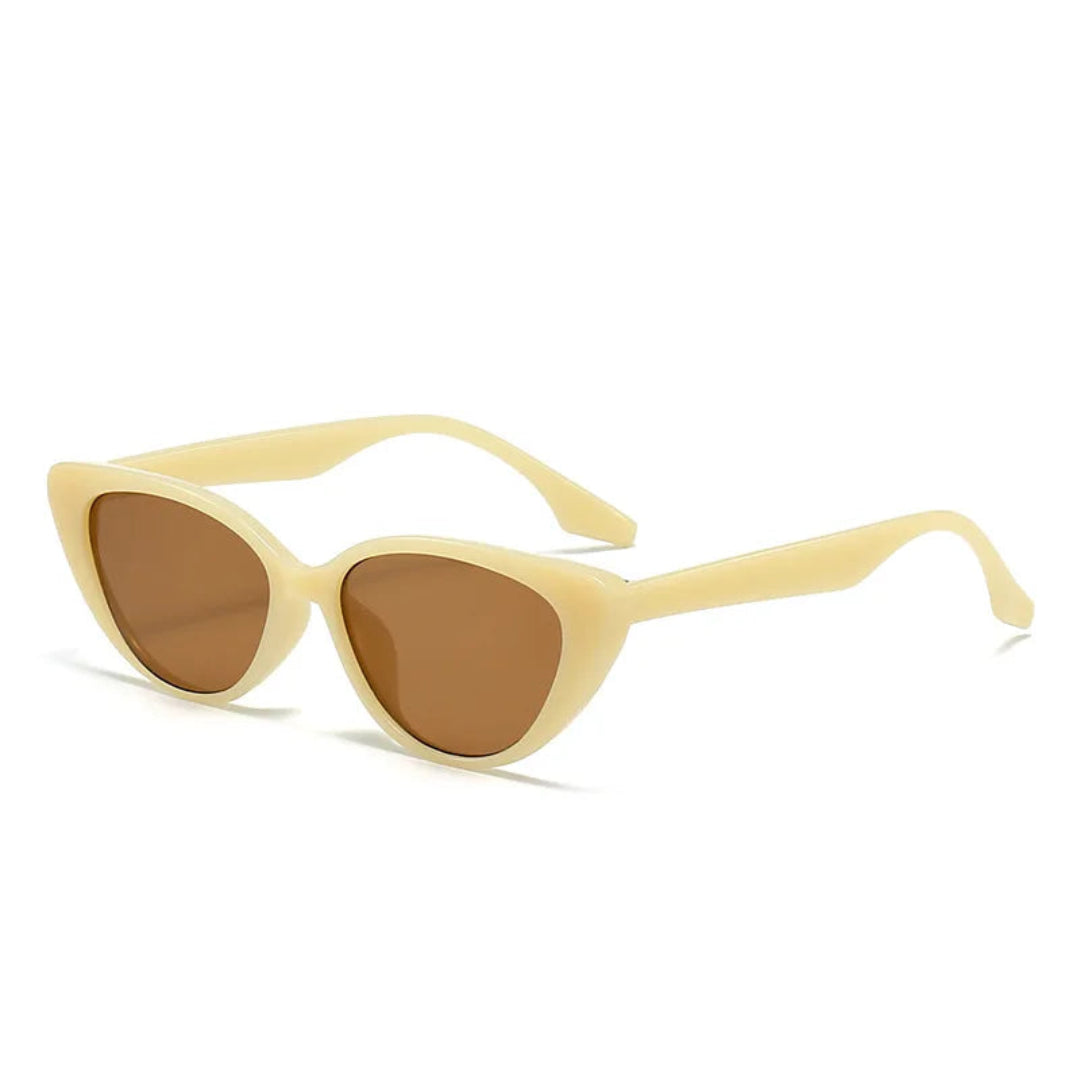 Right 3/4 angle of Noire women’s cat-eye sunglasses in Soft Orange frame with Amber lenses, on white background — polycarbonate frame, acrylic lenses, 100% UV protection