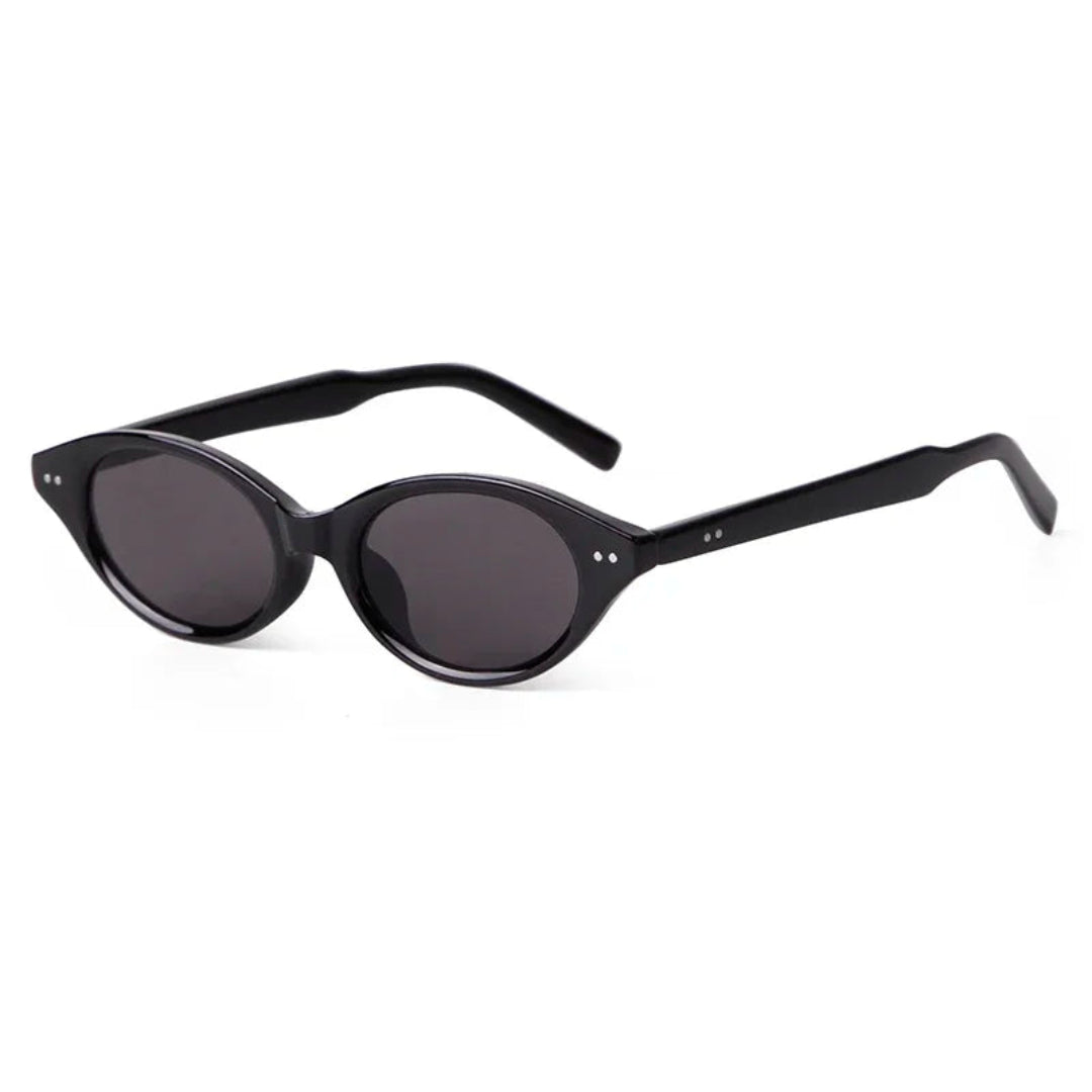 Sovereign women’s oval slim sunglasses in Black frame with Black lenses, right 3/4 angle on white background — polycarbonate frame, acrylic lenses, 100% UV protection