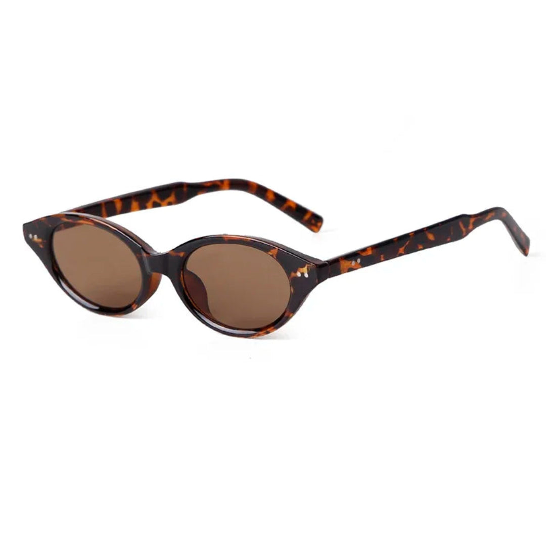 Sovereign women’s oval slim  shades in Tortoise frame with Amber lenses, right 3/4 angle on white background — polycarbonate frame, acrylic lenses, 100% UV protection