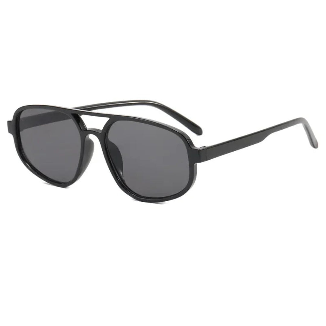 Brigitte aviator women's sunglasses in black polycarbonate frame with black acrylic lenses, 100% UV protection, right 3/4 angle view on white background